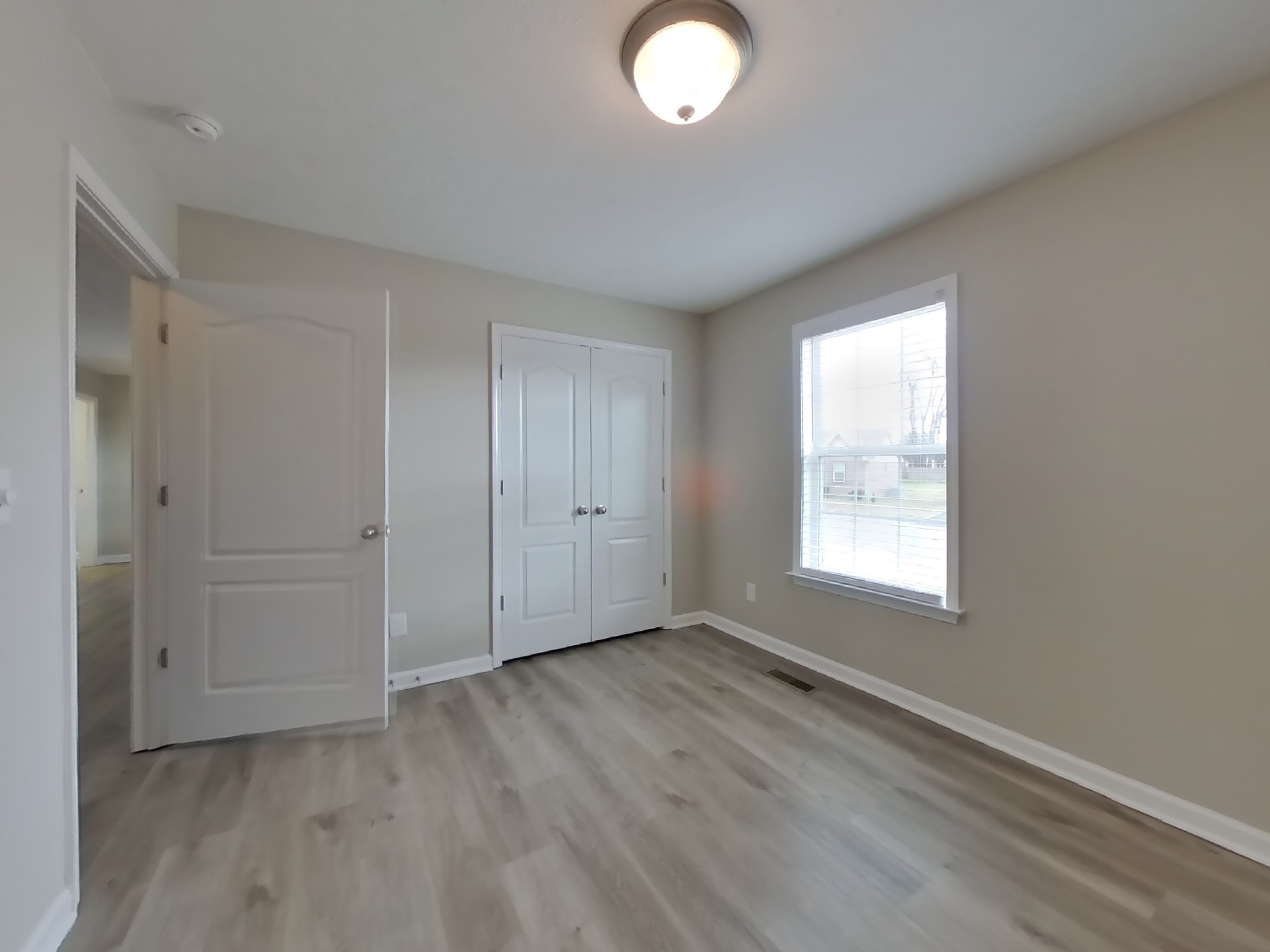 1908 Susan Road Columbia, TN 38401 - Photo 11 of 15 an empty room with wooden floor and windows