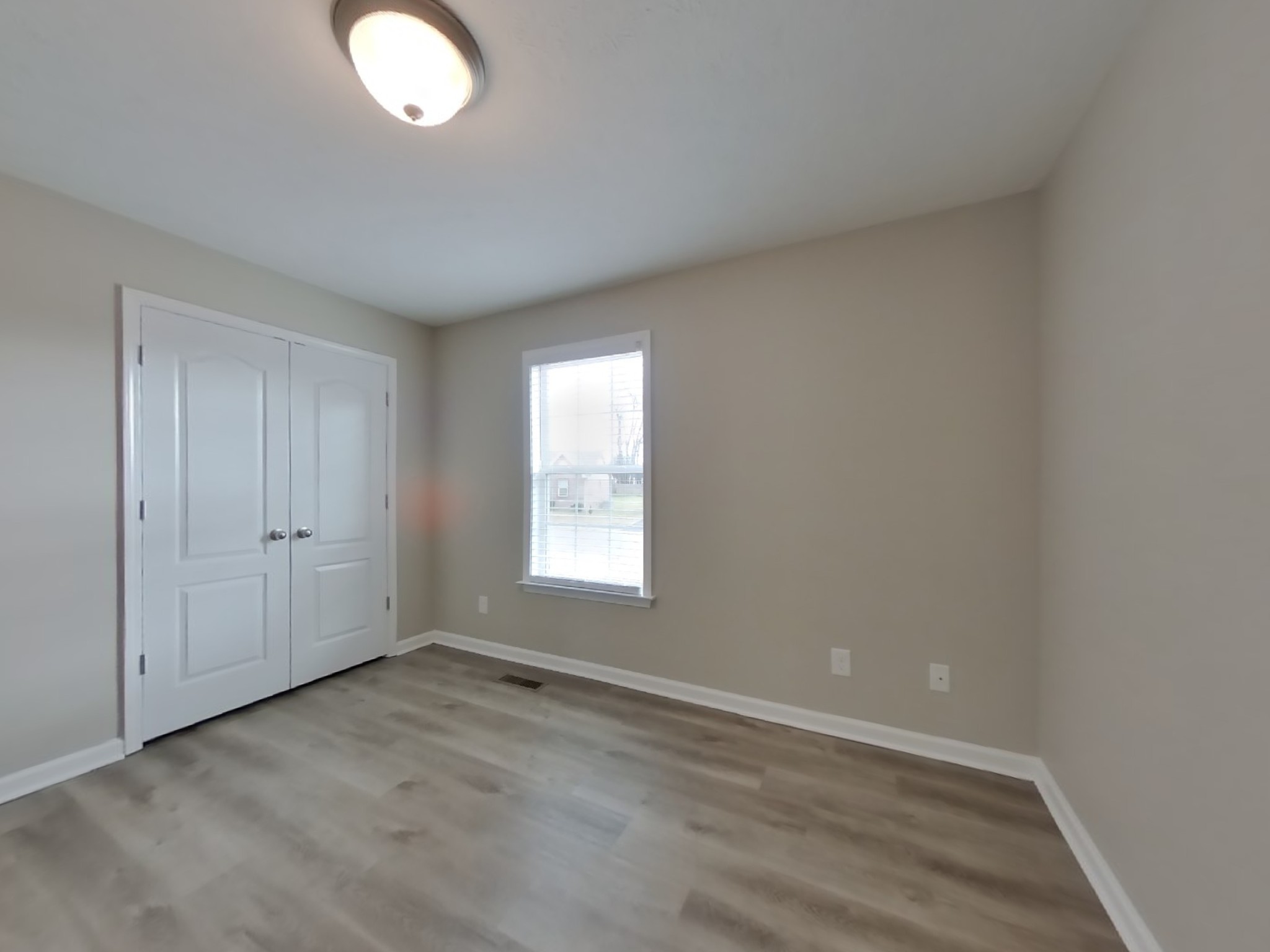1908 Susan Road Columbia, TN 38401 - Photo 12 of 15 an empty room with wooden floor and windows