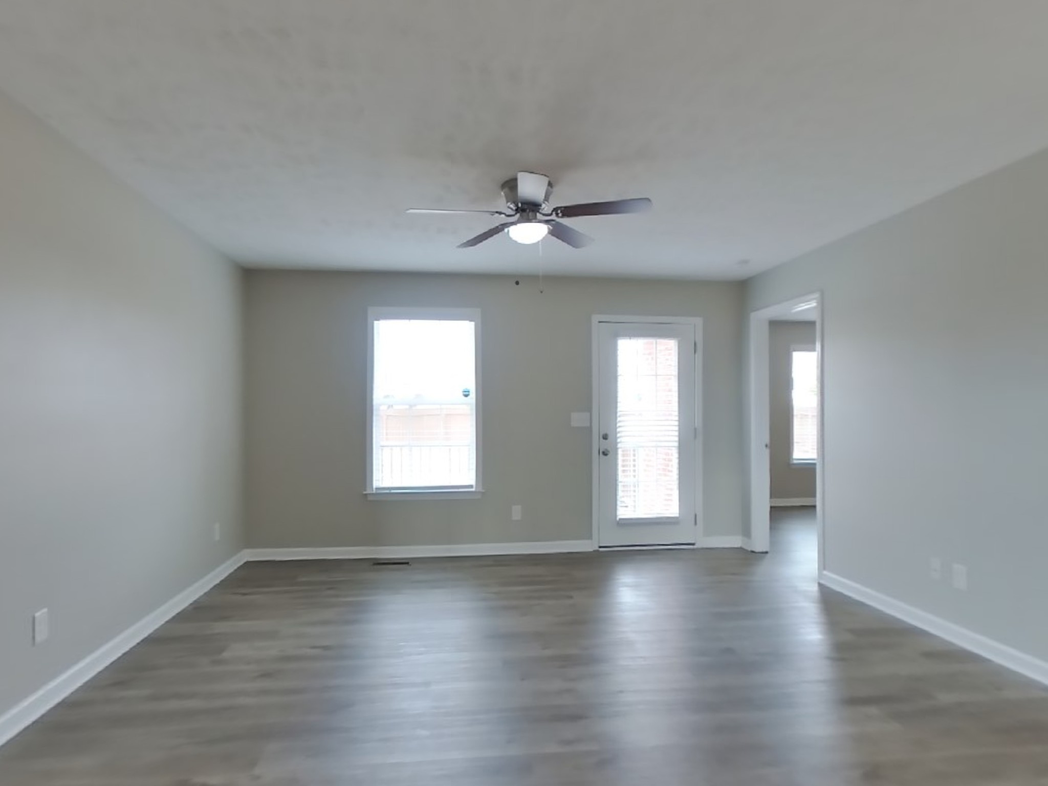 1908 Susan Road Columbia, TN 38401 - Photo 3 of 15 an empty room with wooden floor and windows