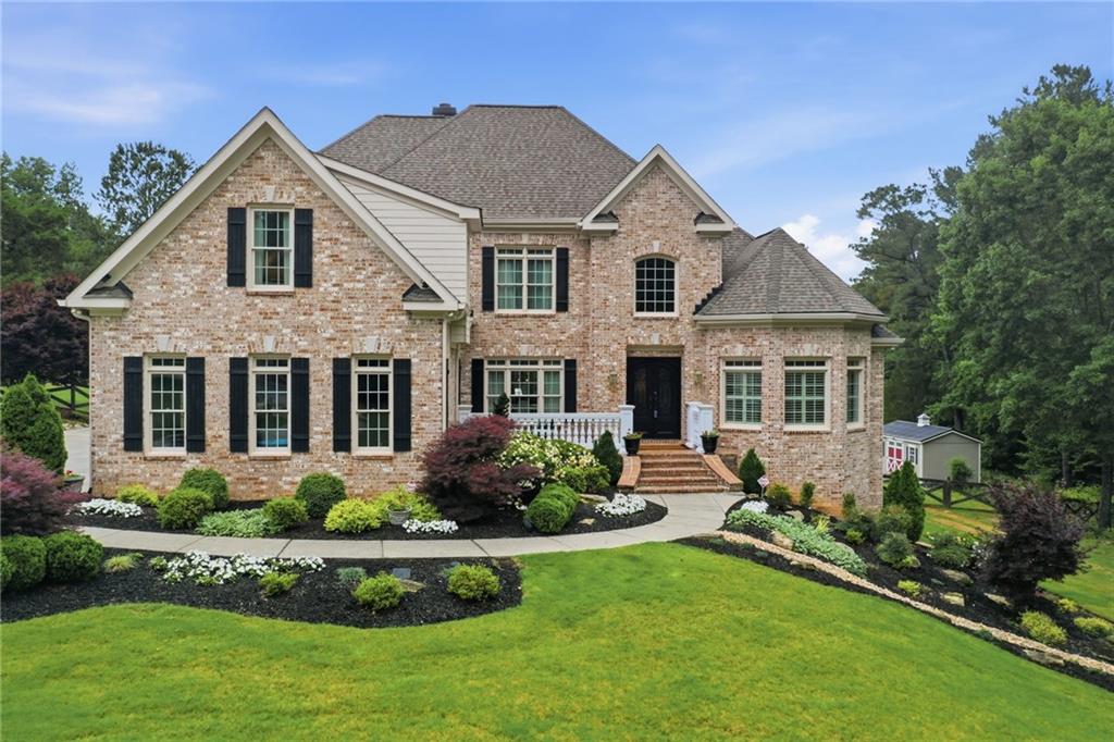 2950 Callie Still Road Lawrenceville, GA 30045 - Photo 1 of 77 a front view of a house with a yard
