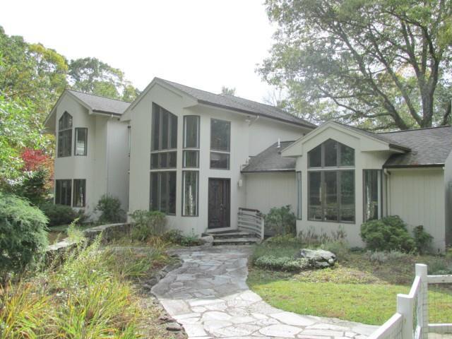 61 Marchant Road Redding, CT 06896 - Photo 1 of 1 a front view of a house with garden
