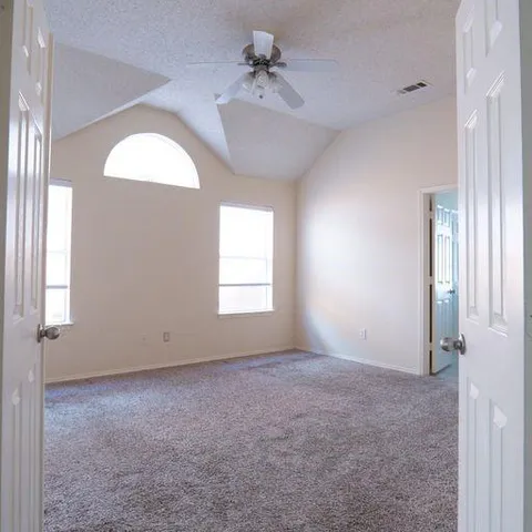 a view of an empty room with a window