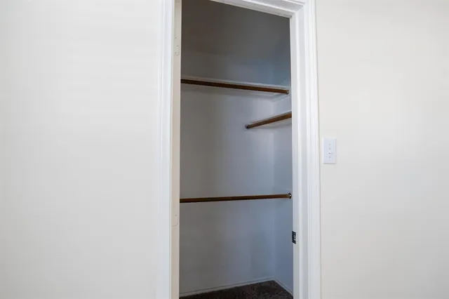 a view of an empty walk in closet
