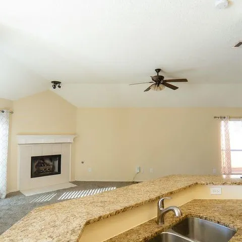 a view of a room with a fireplace