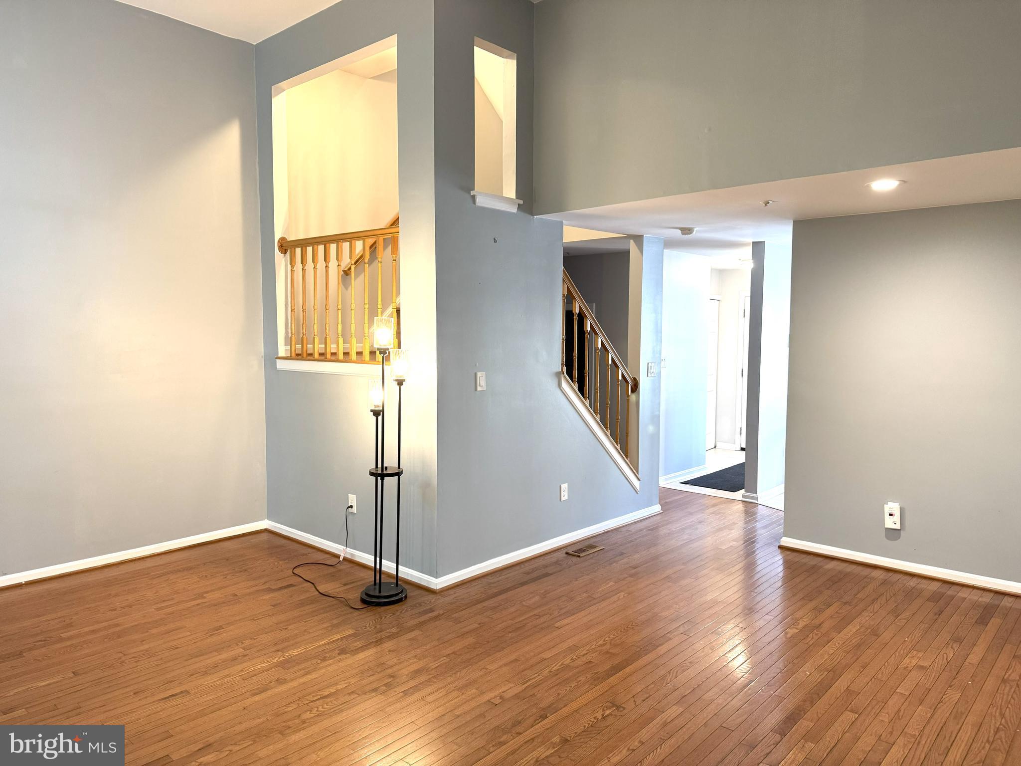 618 Evening Star Place Bowie, MD 20721 - Photo 16 of 59 wooden floor in an empty room with a window