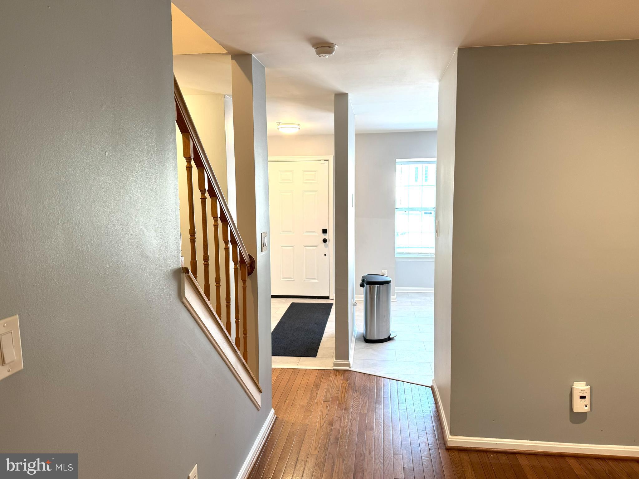618 Evening Star Place Bowie, MD 20721 - Photo 17 of 59 a view of a hallway with wooden floor and staircase