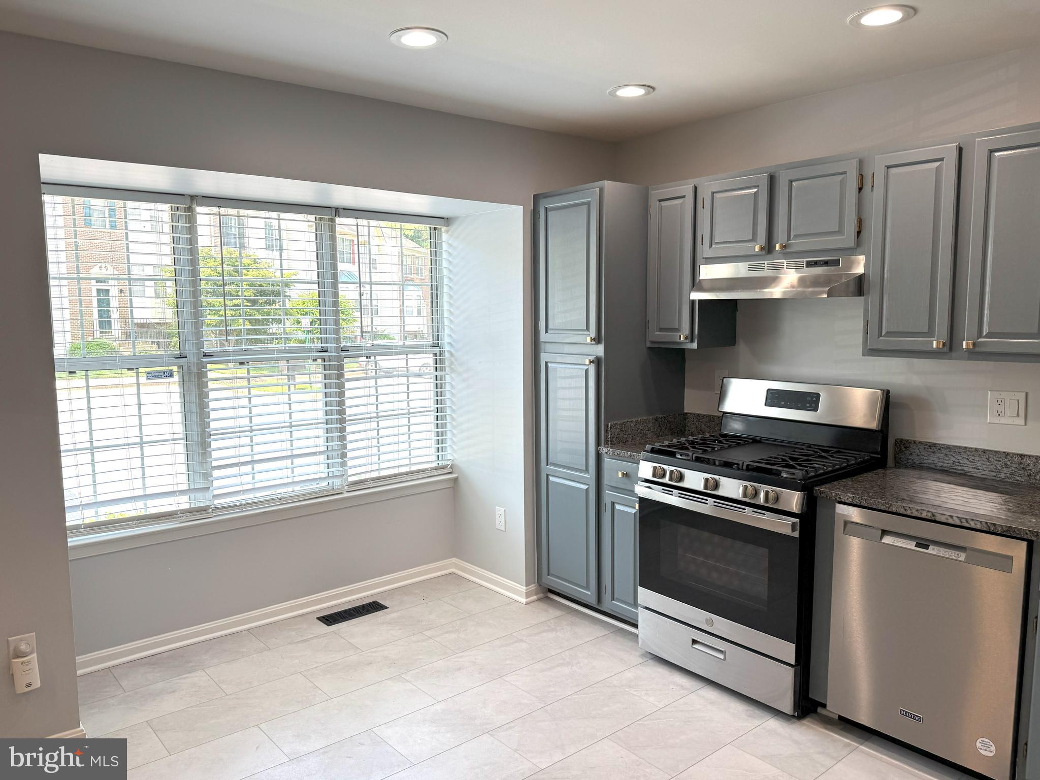618 Evening Star Place Bowie, MD 20721 - Photo 2 of 59 a kitchen with a stove and a sink