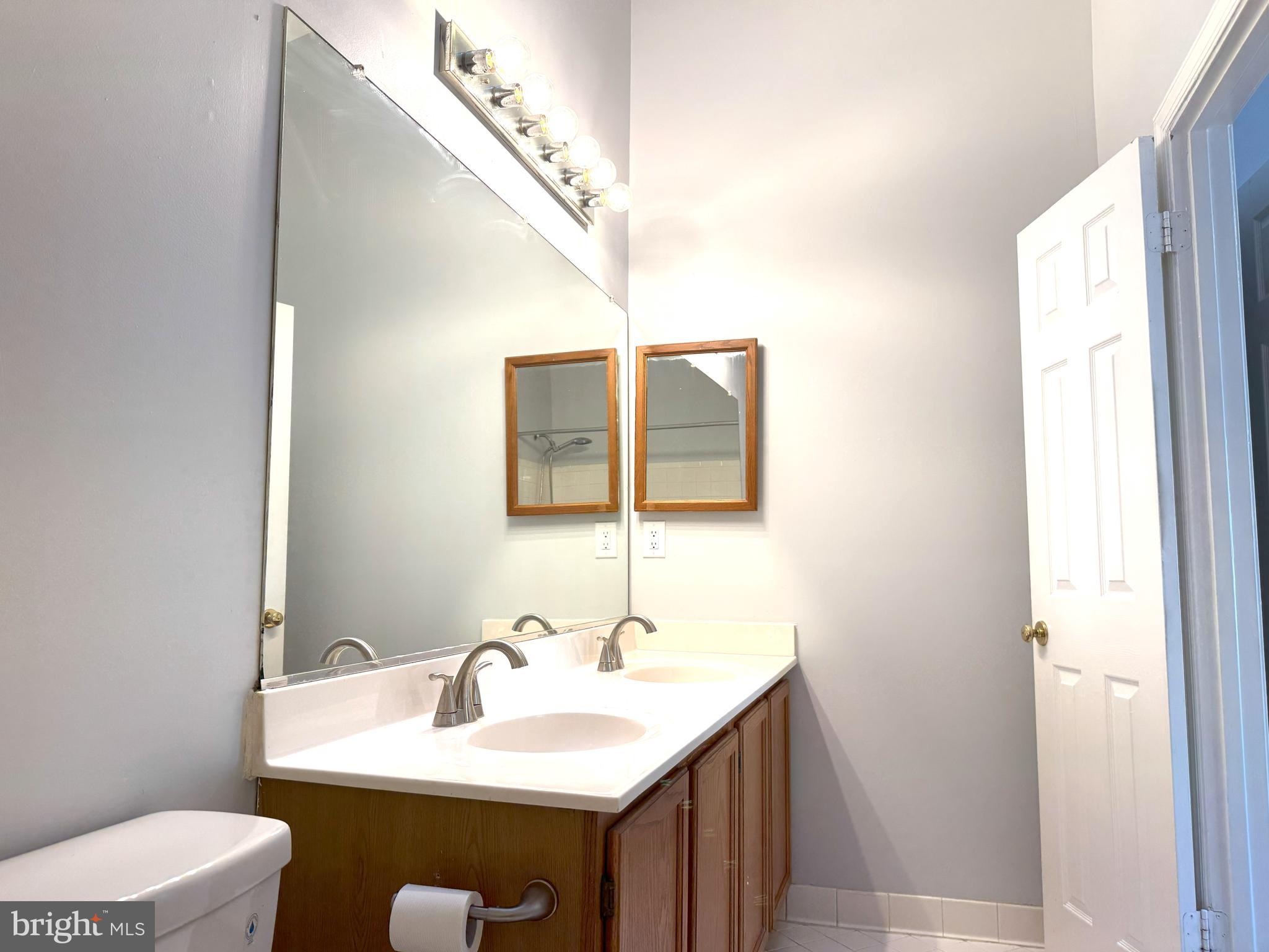 618 Evening Star Place Bowie, MD 20721 - Photo 23 of 59 a bathroom with a sink and a mirror
