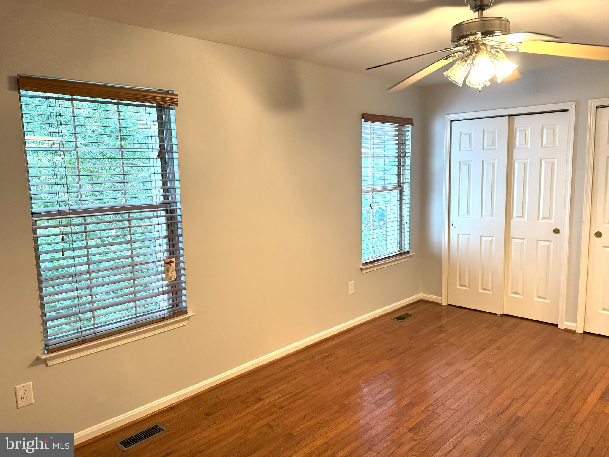 618 Evening Star Place Bowie, MD 20721 - Photo 29 of 59 a view of an empty room with wooden floor and a window