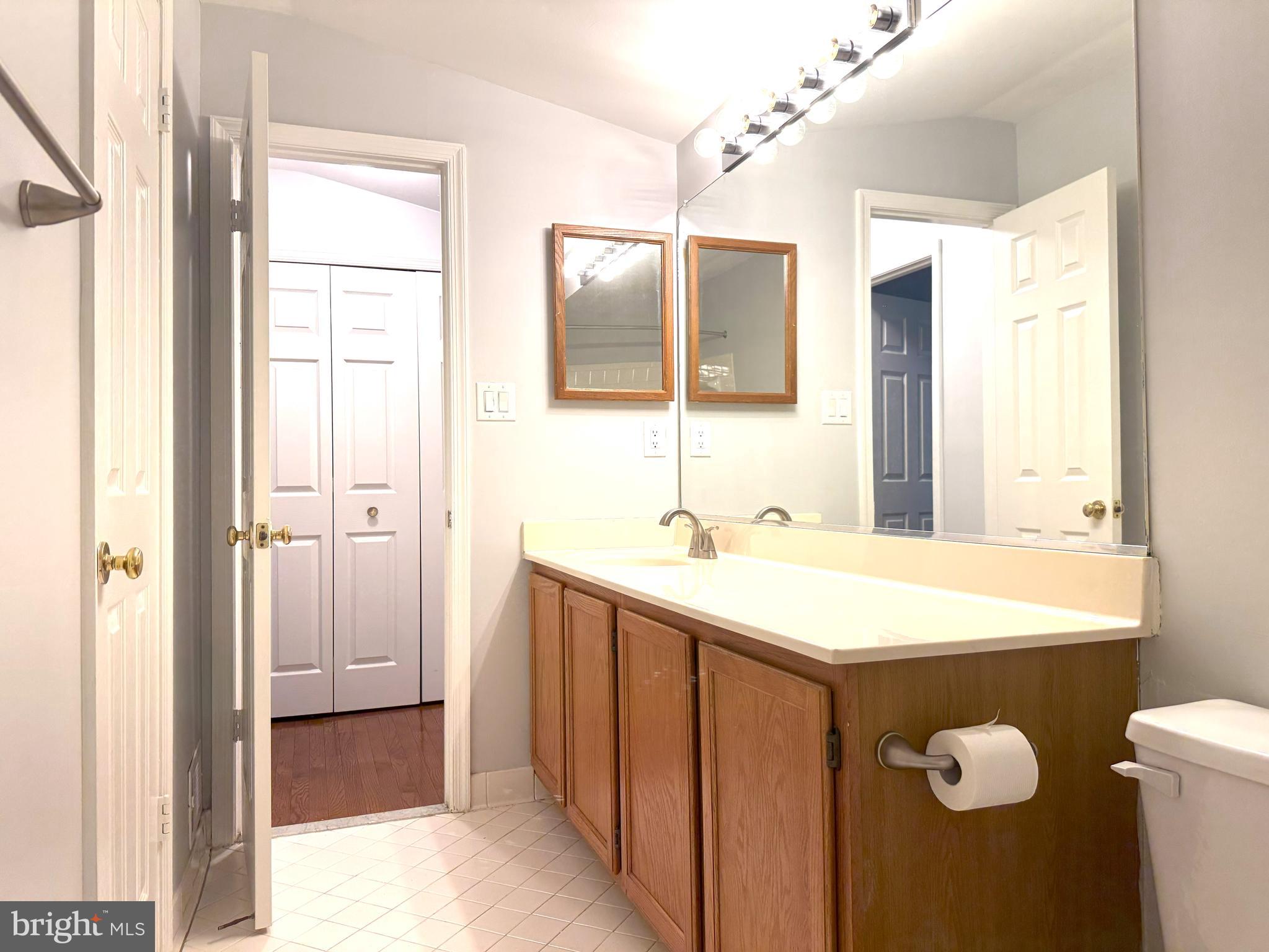 618 Evening Star Place Bowie, MD 20721 - Photo 31 of 59 a bathroom with a sink and a mirror