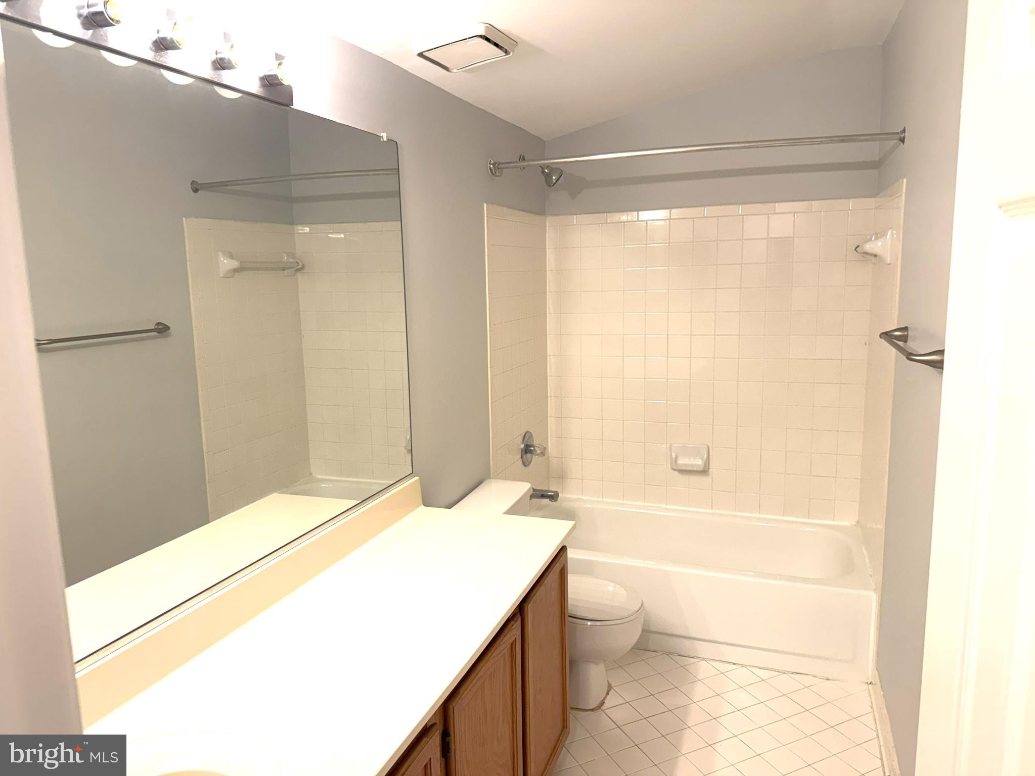 618 Evening Star Place Bowie, MD 20721 - Photo 32 of 59 a bathroom with a granite countertop sink a toilet and shower