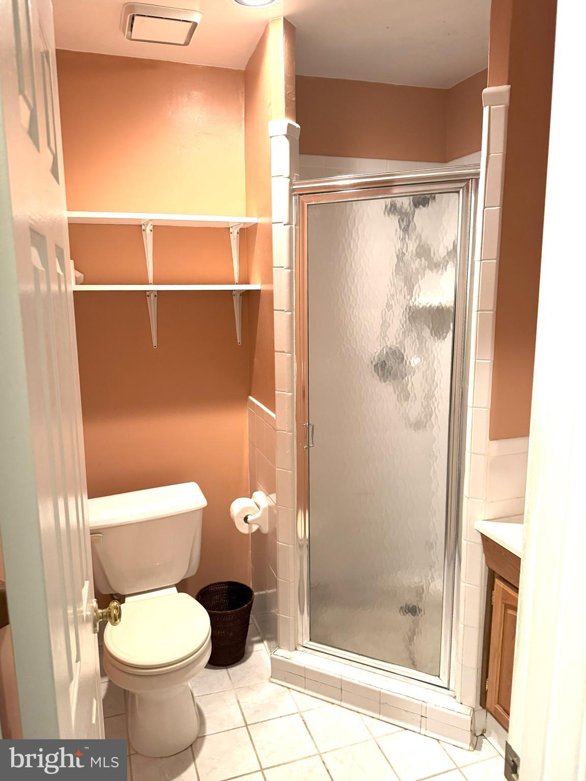 618 Evening Star Place Bowie, MD 20721 - Photo 41 of 59 a white toilet sitting next to a shower