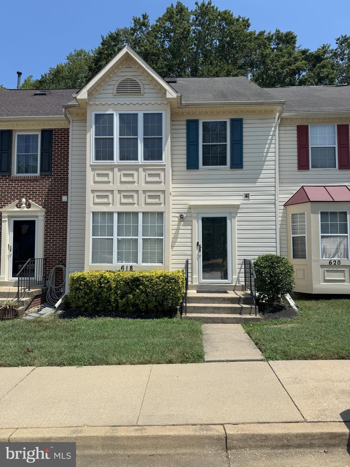 618 Evening Star Place Bowie, MD 20721 - Photo 47 of 59 a front view of a house with a yard