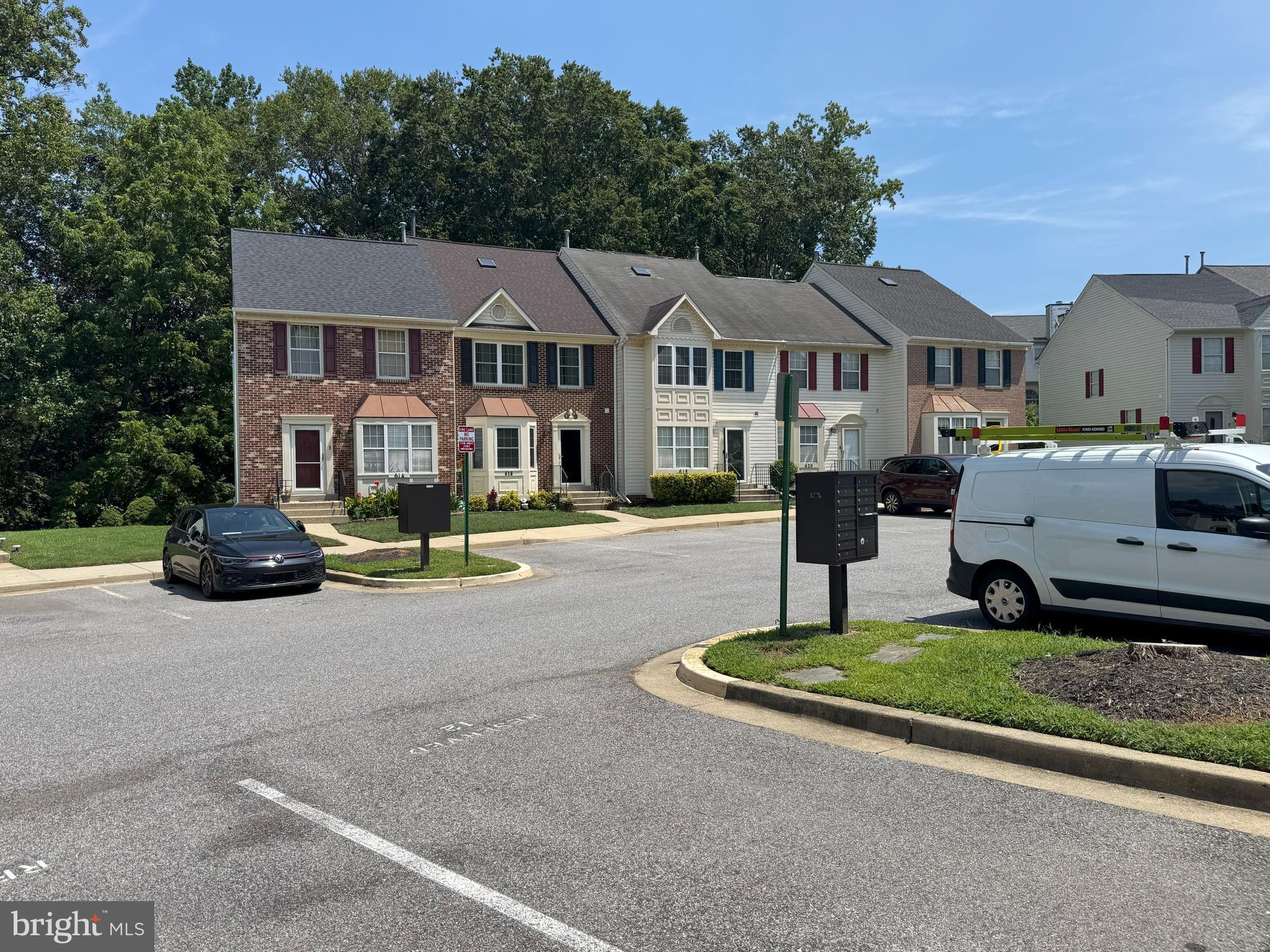 618 Evening Star Place Bowie, MD 20721 - Photo 53 of 59 a front view of a house with a garden and tree