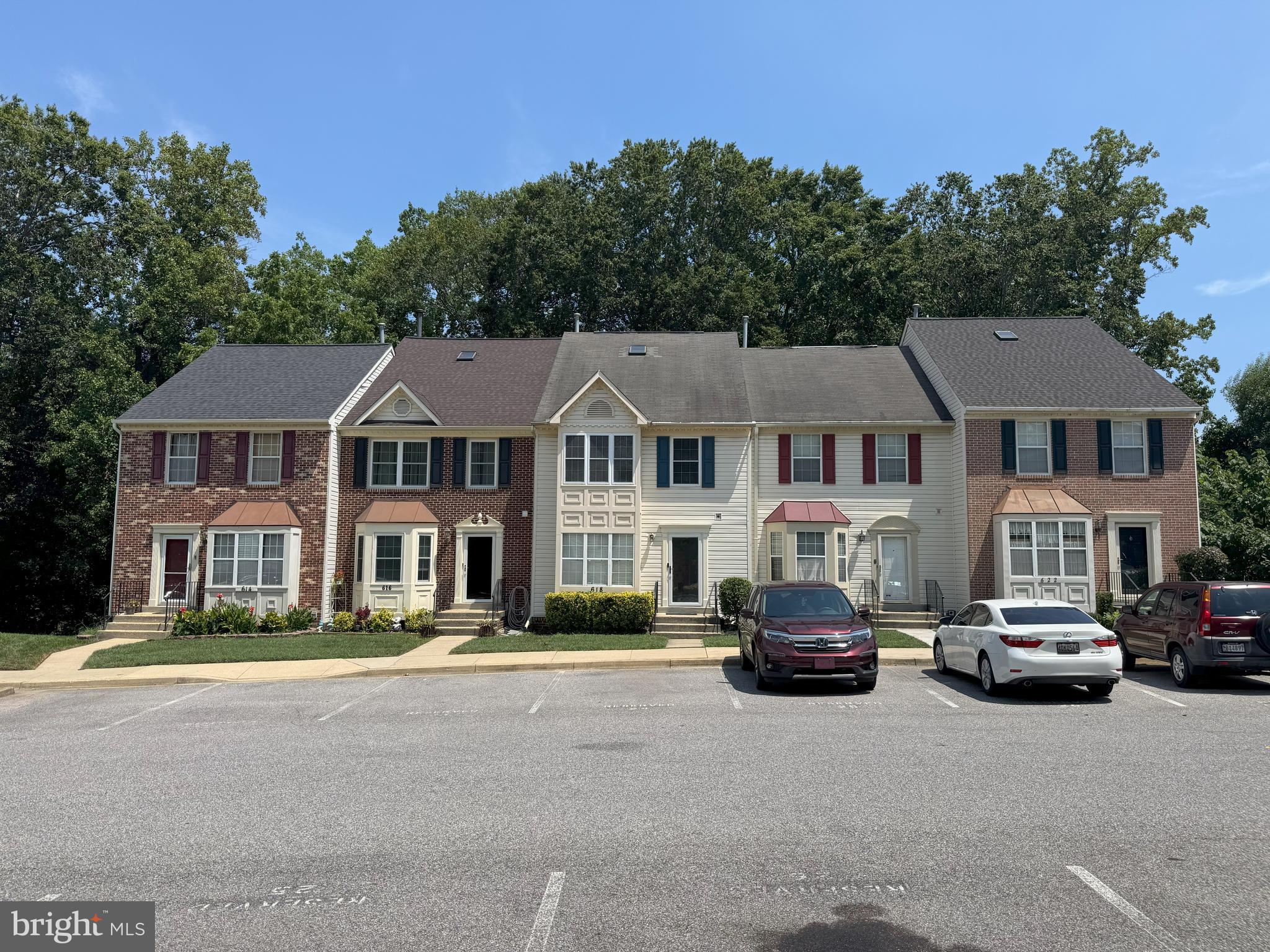 618 Evening Star Place Bowie, MD 20721 - Photo 54 of 59 a car parked in front of a white house