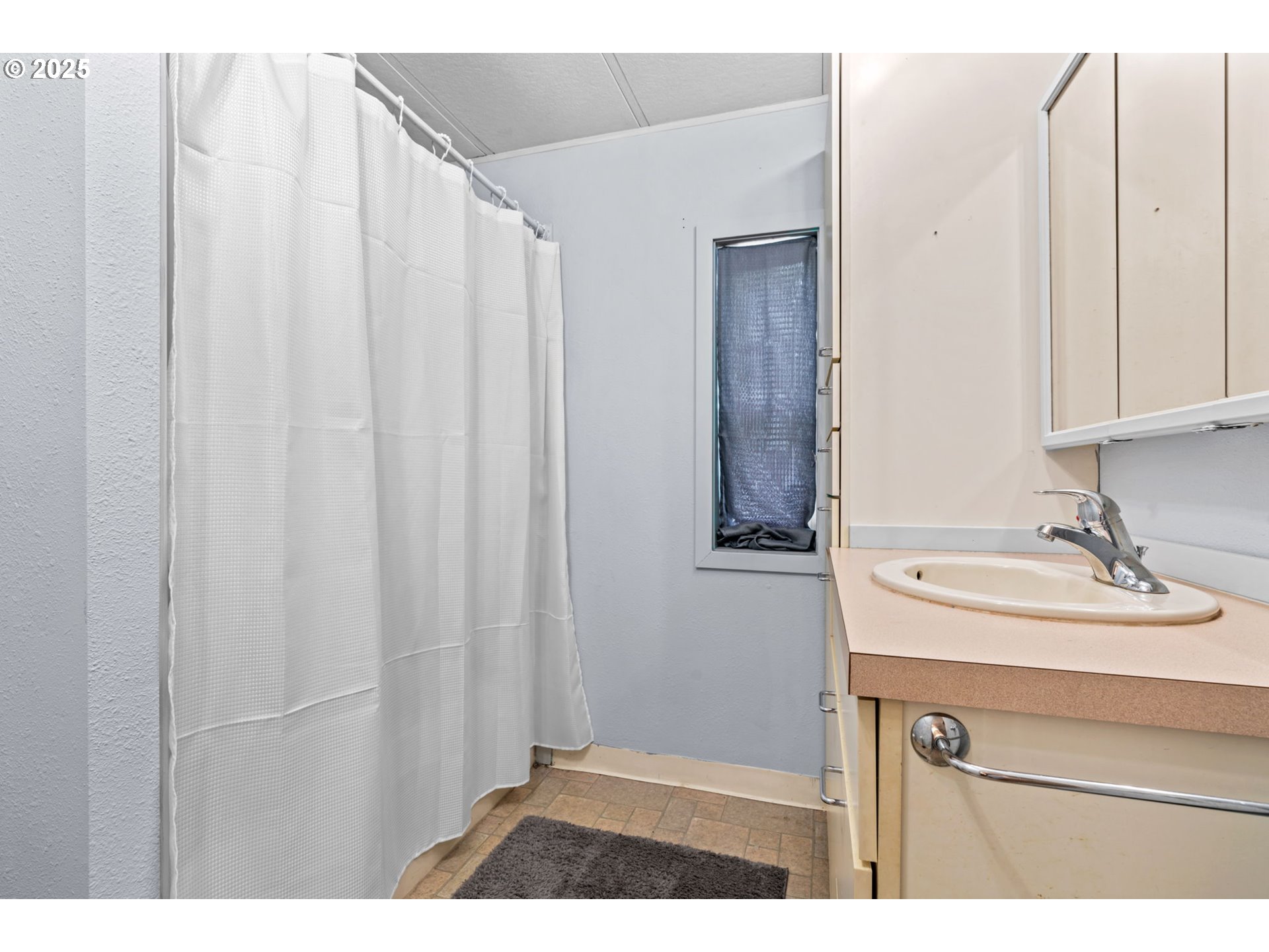 90245 Sheffler Road Elmira, OR 97437 - Photo 11 of 33 a bathroom with a sink and a mirror