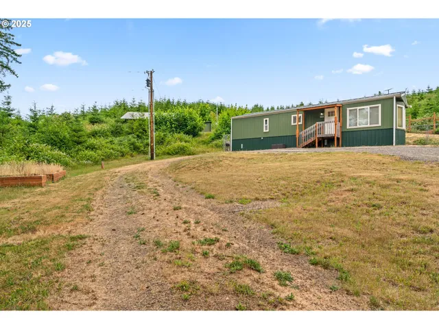 a front view of a house with a yard and a garage
