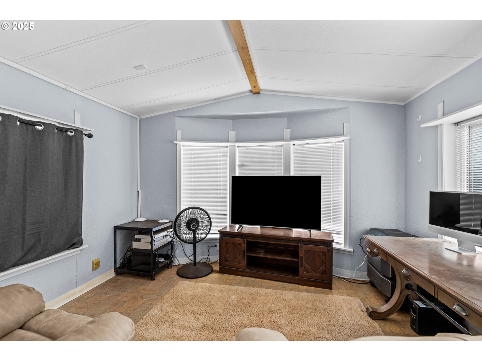 90245 Sheffler Road Elmira, OR 97437 - Photo 2 of 33 a living room with furniture and a flat screen tv