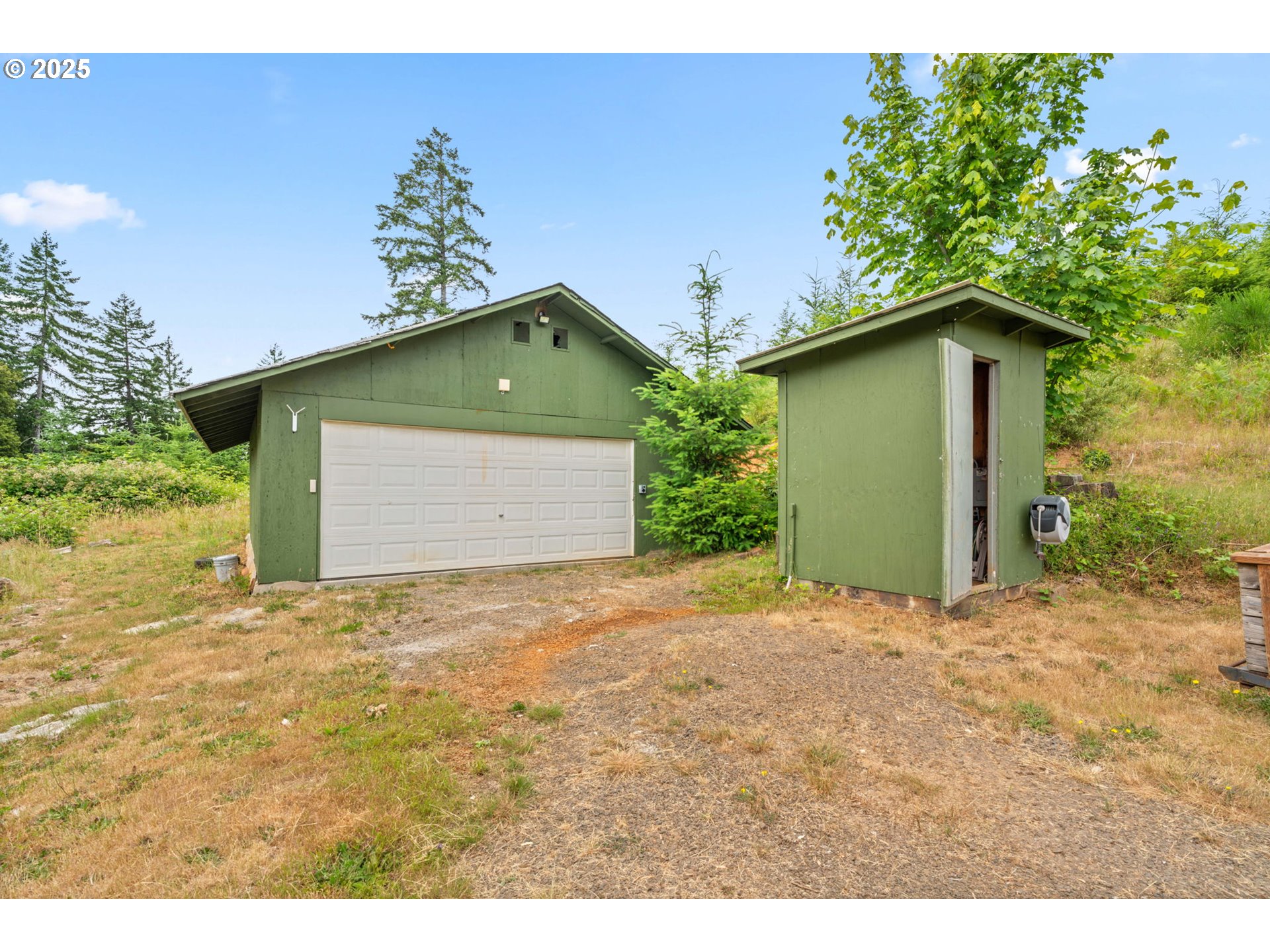 90245 Sheffler Road Elmira, OR 97437 - Photo 31 of 33 a front view of a house with a yard and garage