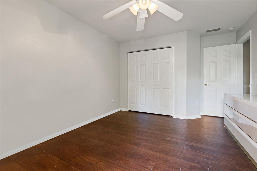 5065 Southwest 128th Street Ocala, FL 34473 - Photo 16 of 31 a view of an empty room with wooden floor