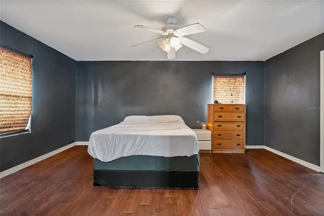 a living room with a bed furniture and a window