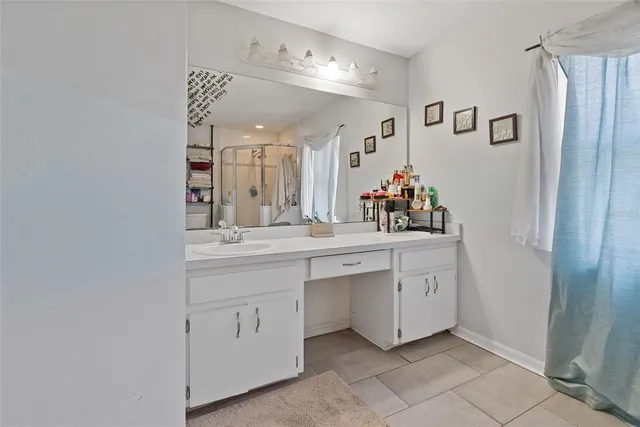 a spacious bathroom with a double vanity sink mirror and