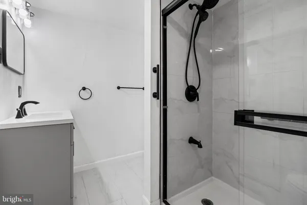 a bathroom with a shower sink