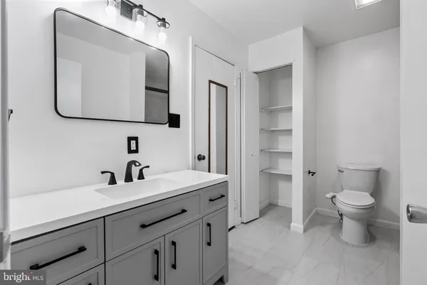 a bathroom with a shower and a toilet