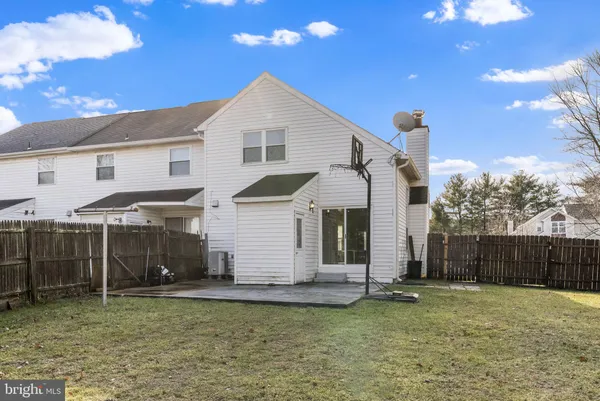 a view of a garden with a house