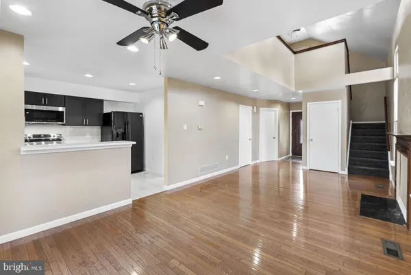 a view of kitchen with cabinets and wooden floor