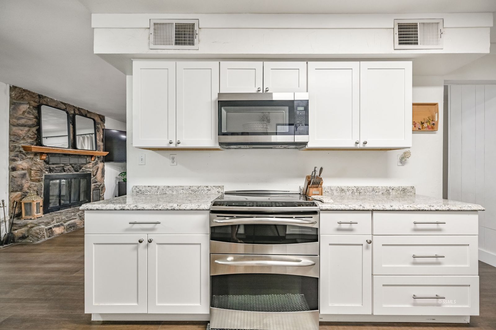 1407 North Indian Wells Street Ridgecrest, CA 93555 - Photo 6 of 50 a kitchen with granite countertop cabinets stainless steel appliances and a counter space