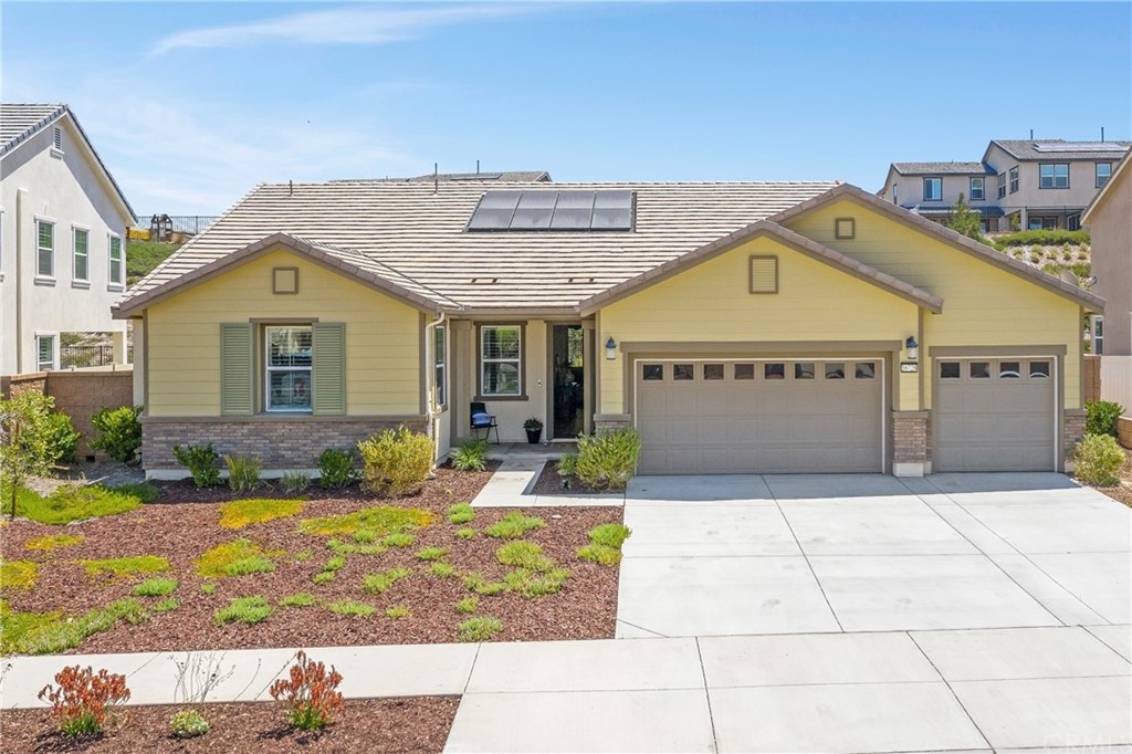 16728 Fleur Boulevard Riverside, CA 92503 - Photo 1 of 1 a front view of a house with garden