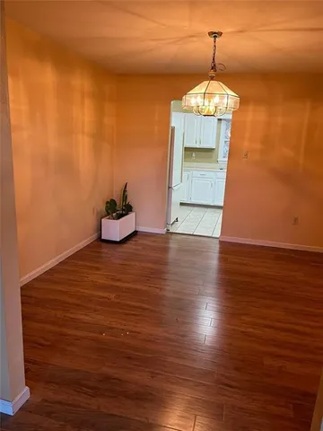 a view of a livingroom with wooden floor