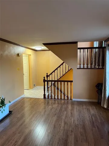 a bathroom with a granite countertop toilet sink and mirror