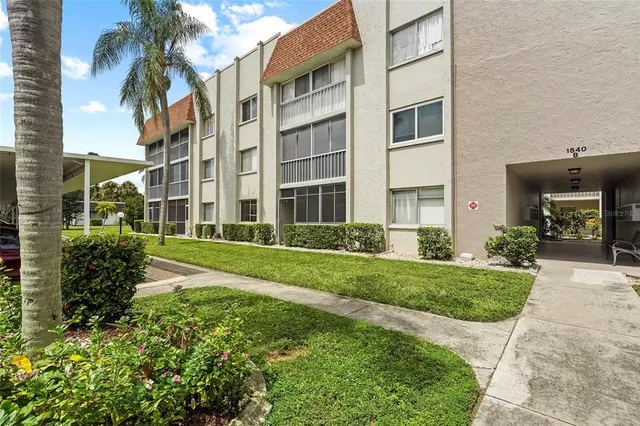 a view of a building with a yard