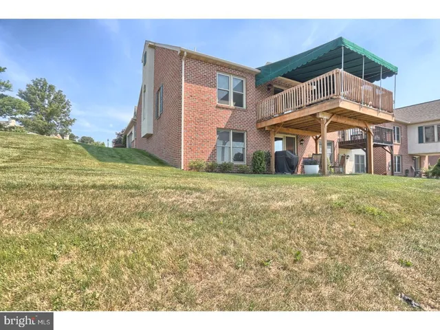 a view of balcony with wooden floor and city view