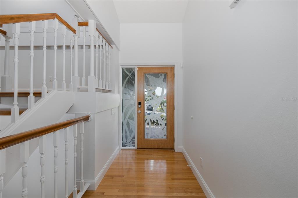 3150 Trident Terrace New Port Richey, FL 34652 - Photo 11 of 99 a view of a hallway with wooden floor and entryway