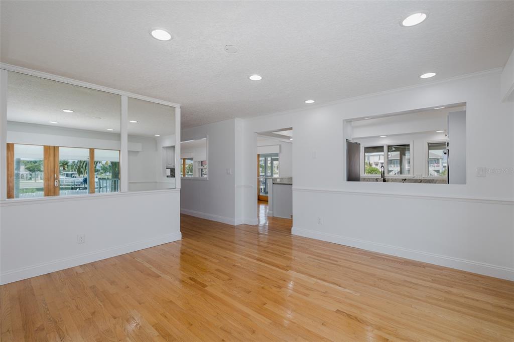 3150 Trident Terrace New Port Richey, FL 34652 - Photo 15 of 99 a view of an empty room with wooden floor and a window