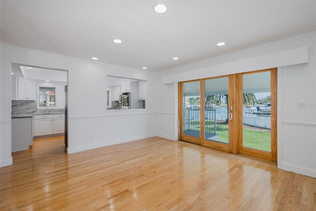 3150 Trident Terrace New Port Richey, FL 34652 - Photo 24 of 99 wooden floor in an empty room with a window