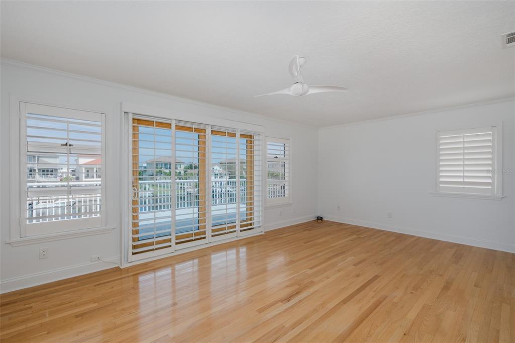 3150 Trident Terrace New Port Richey, FL 34652 - Photo 27 of 99 a view of an empty room with wooden floor and a window