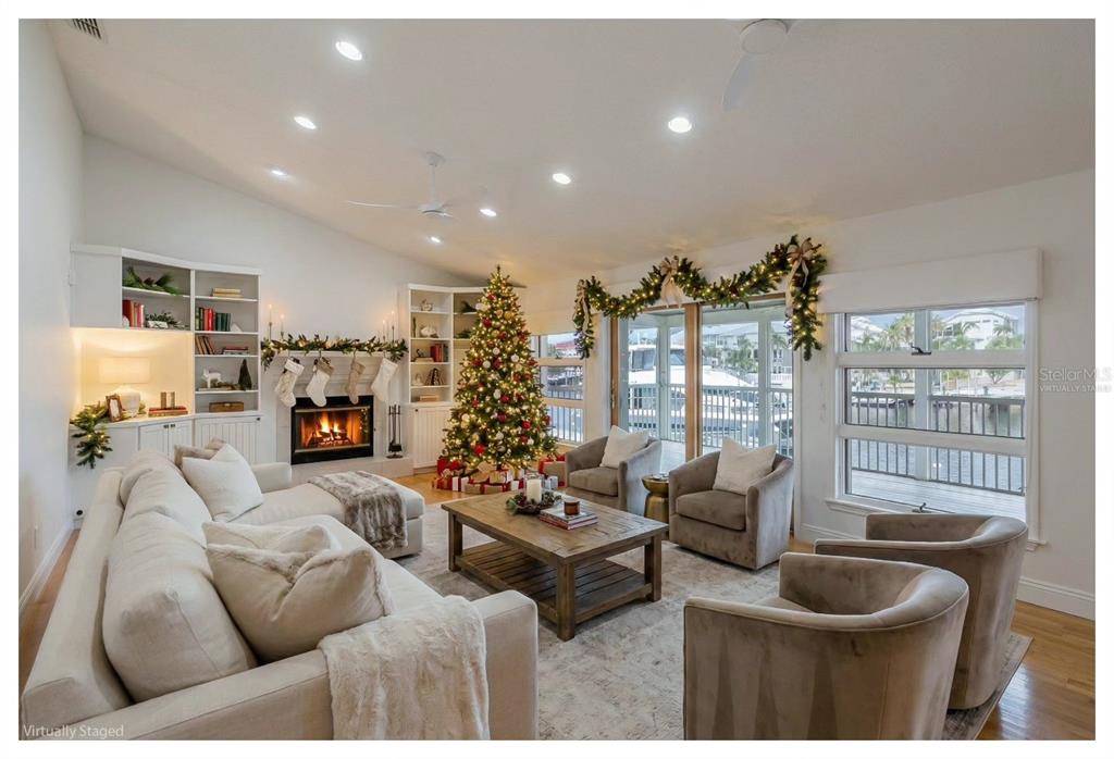 3150 Trident Terrace New Port Richey, FL 34652 - Photo 3 of 99 a living room with furniture and a floor to ceiling window