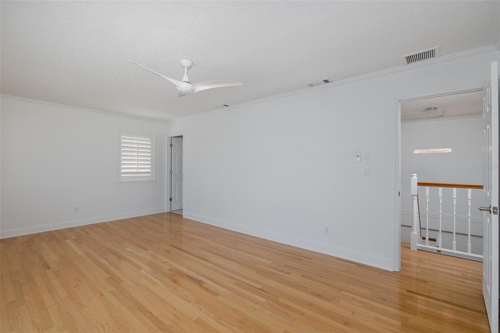 3150 Trident Terrace New Port Richey, FL 34652 - Photo 40 of 99 an empty room with wooden floor and windows