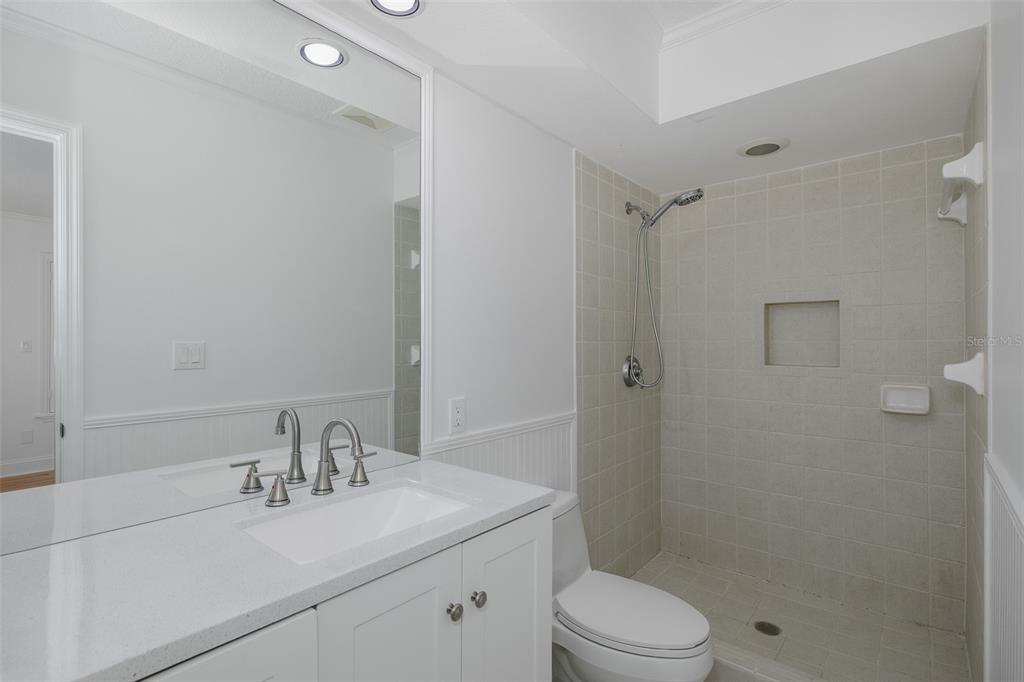 3150 Trident Terrace New Port Richey, FL 34652 - Photo 42 of 99 a bathroom with a sink toilet vanity and shower
