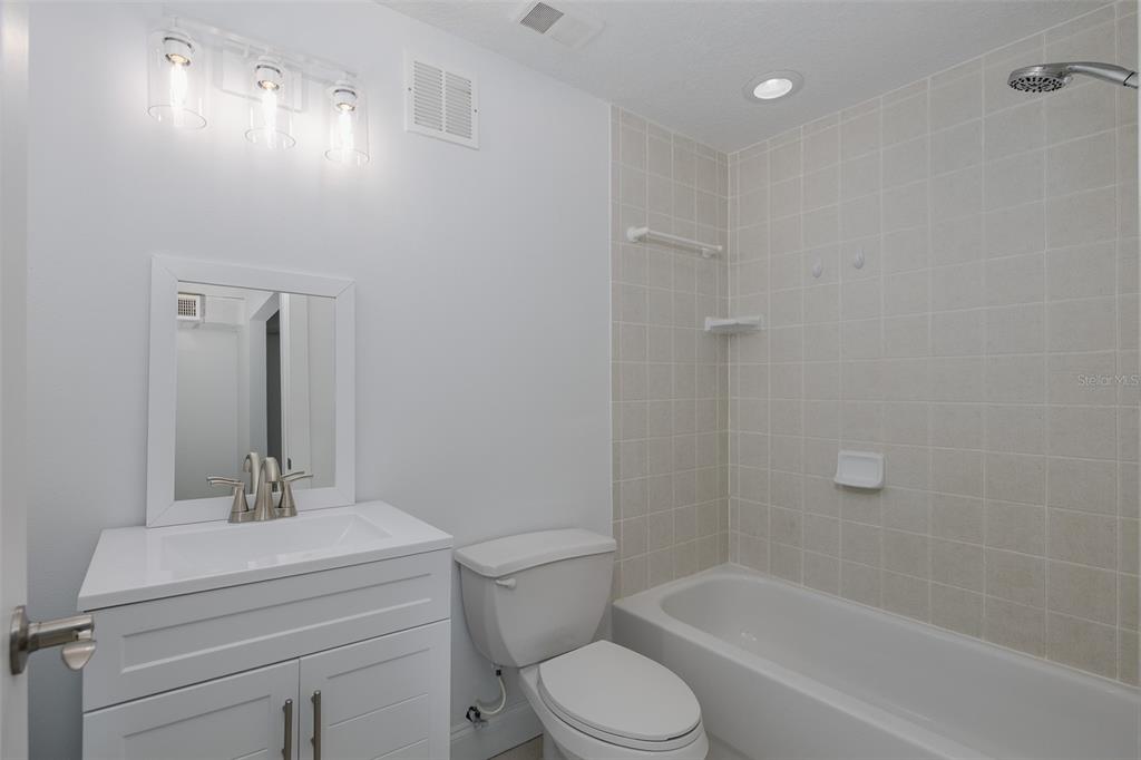 3150 Trident Terrace New Port Richey, FL 34652 - Photo 51 of 99 a bathroom with a sink a toilet and shower