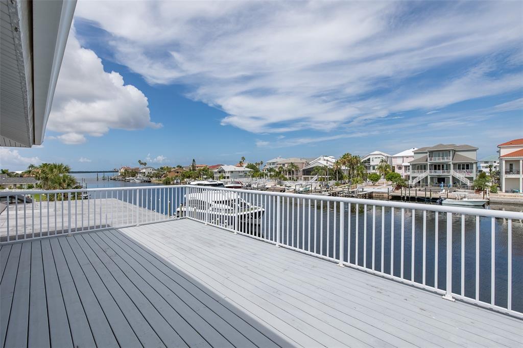 3150 Trident Terrace New Port Richey, FL 34652 - Photo 55 of 99 a view of roof deck with two chairs and wooden floor