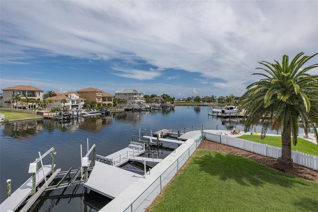 3150 Trident Terrace New Port Richey, FL 34652 - Photo 64 of 99 a view of a lake with couches and city view