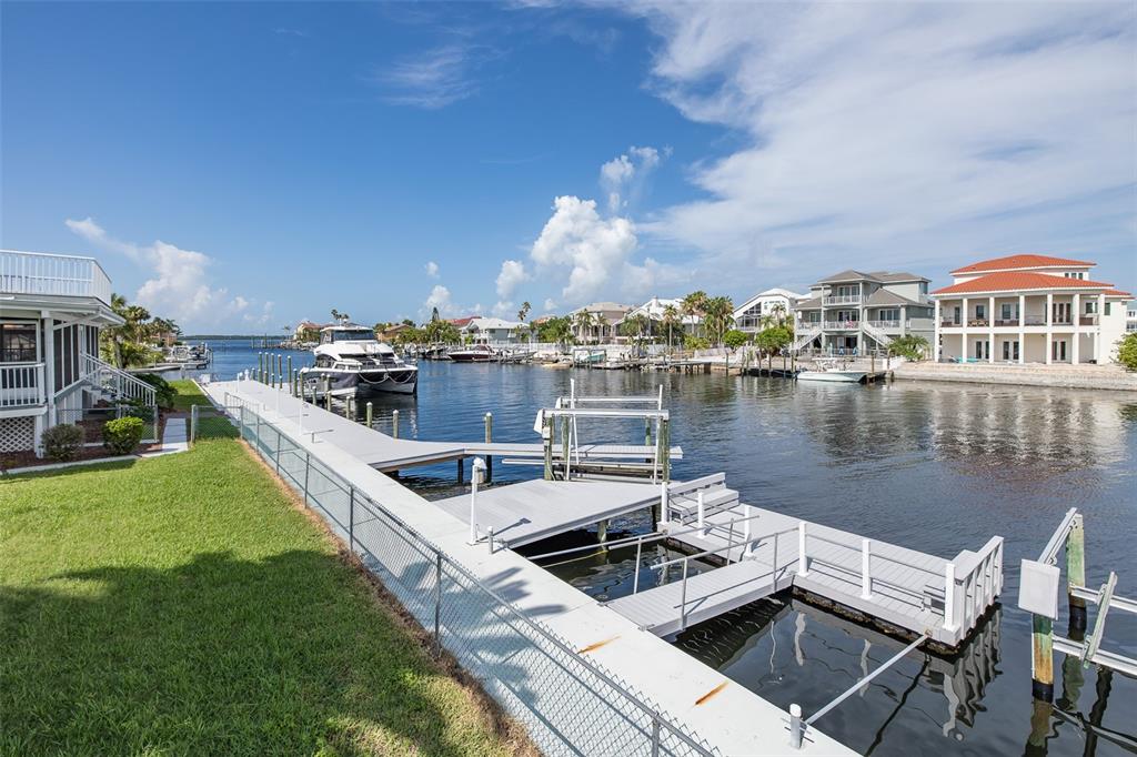 3150 Trident Terrace New Port Richey, FL 34652 - Photo 67 of 99 a view of a lake with a house swimming pool and outdoor space