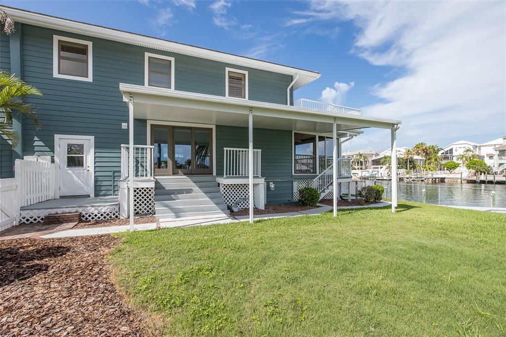 3150 Trident Terrace New Port Richey, FL 34652 - Photo 7 of 99 a view of a house with a yard and sitting area
