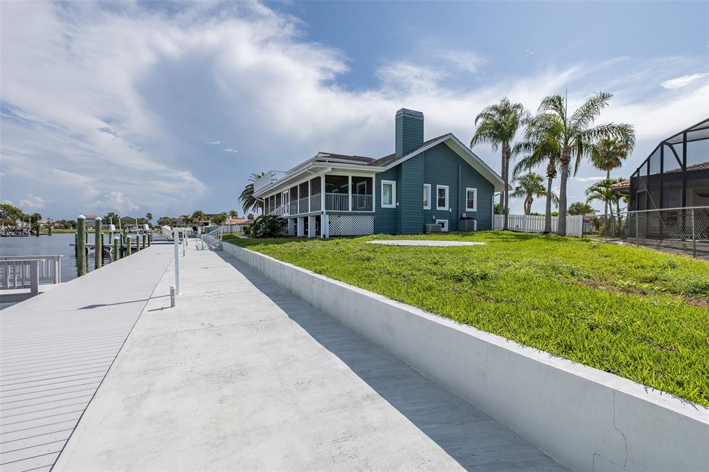 3150 Trident Terrace New Port Richey, FL 34652 - Photo 77 of 99 a view of house with a yard