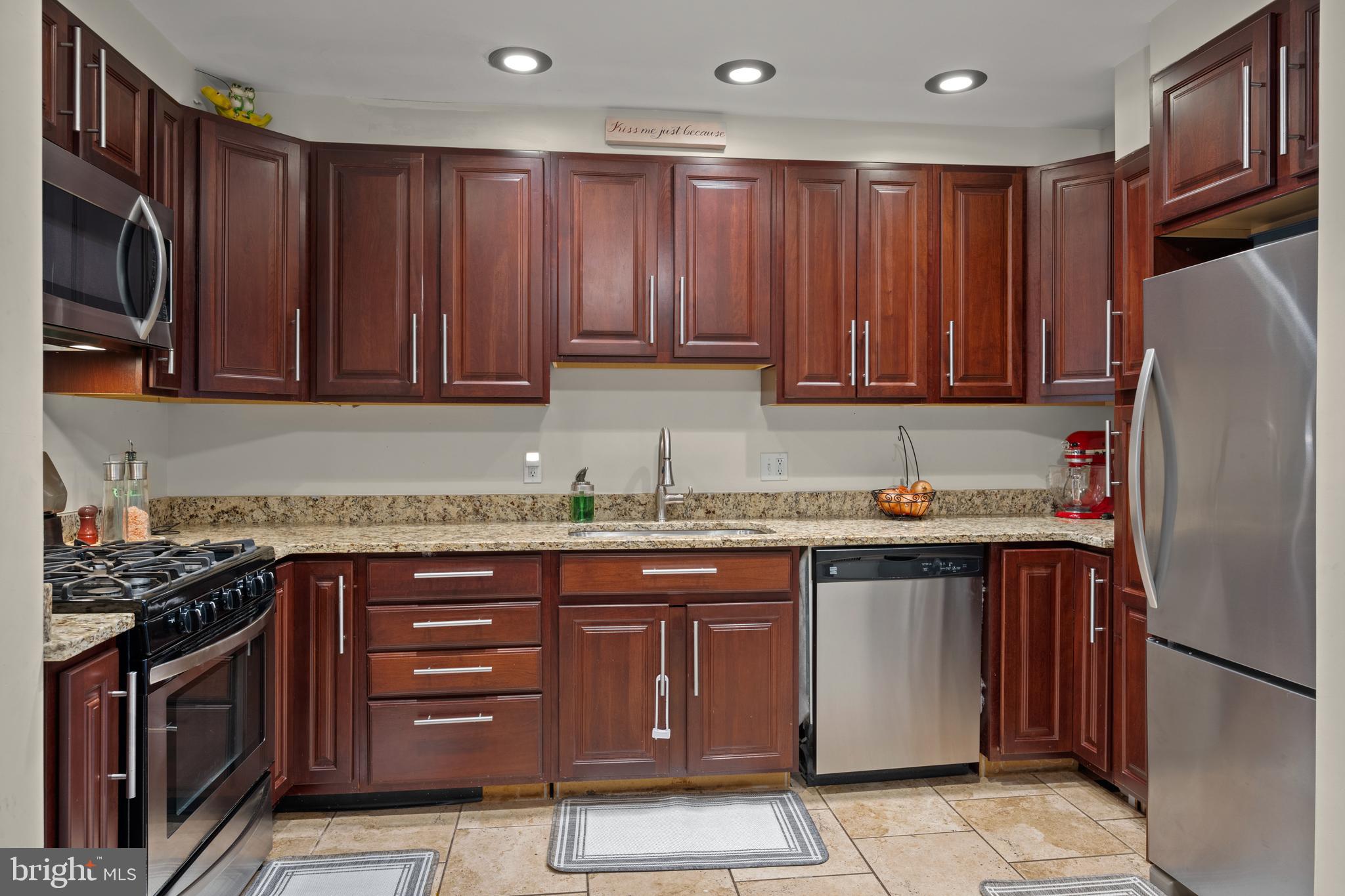 1955 Holborn Road Baltimore, MD 21222 - Photo 12 of 36 a kitchen with stainless steel appliances granite countertop a refrigerator and a stove top oven